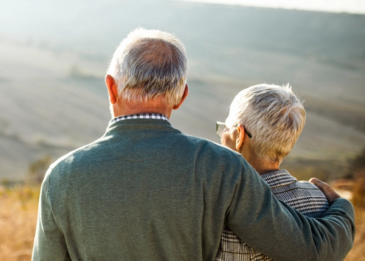 Retired couple looking at family
